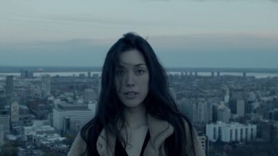 women overlooking cityscape 